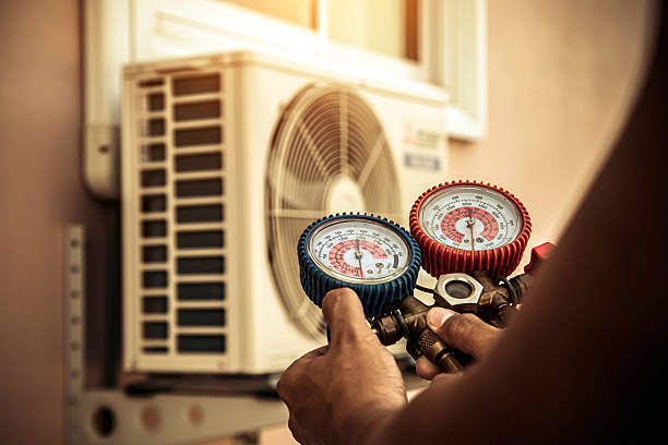 Professional Air Conditioning Service technician working in Sumner, IL